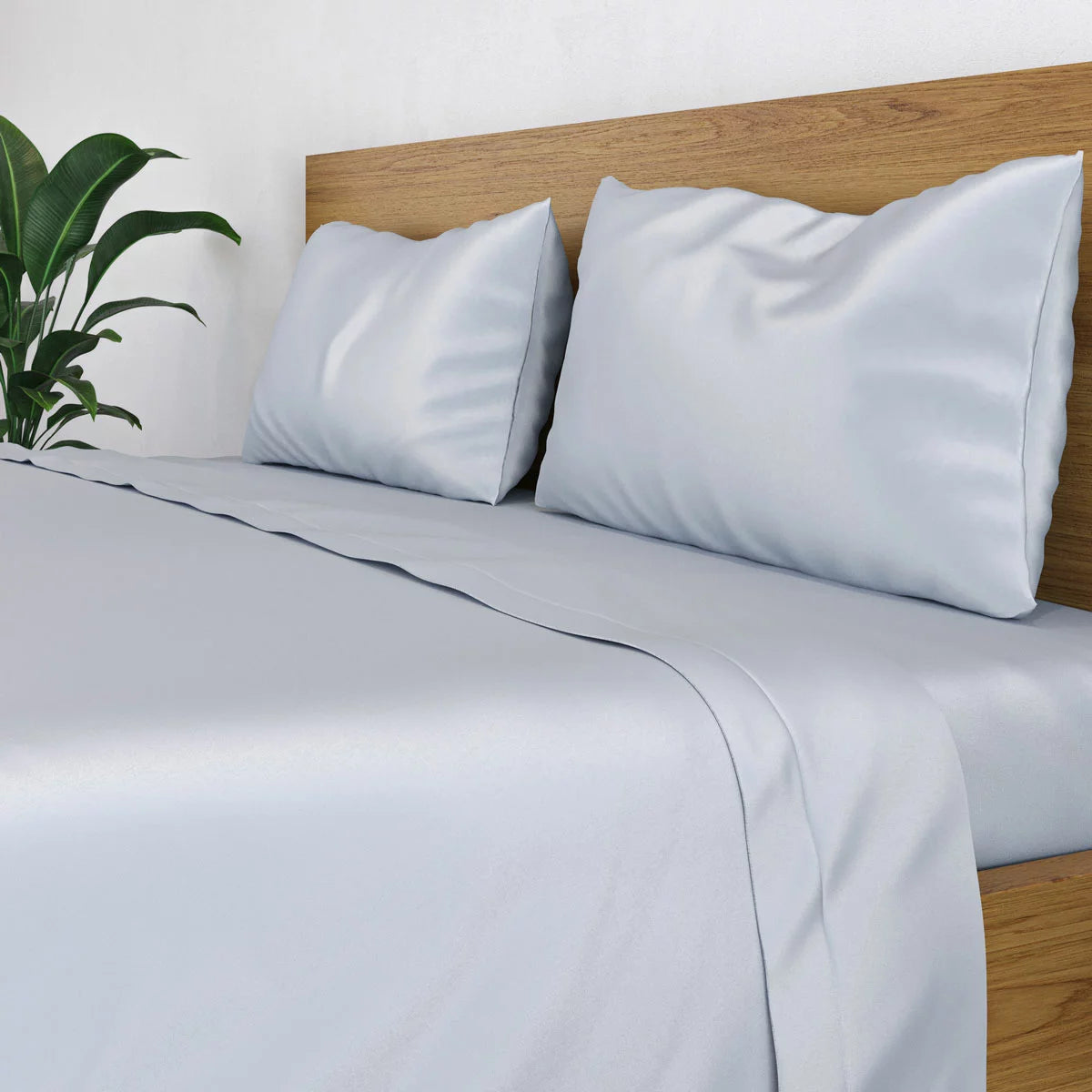 Crisp white Panda 100 percent bamboo flat sheet folded neatly on a bed showing its silky texture and natural luster.