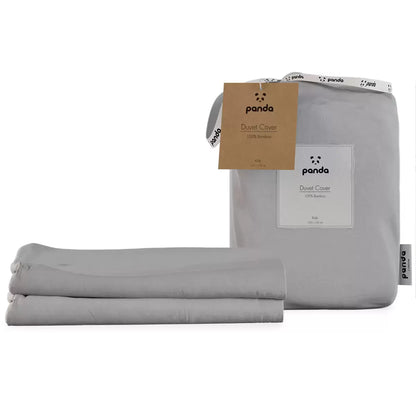Soft white Panda Children's 100% Bamboo Duvet Cover neatly folded on a cot bed displaying its silky sateen texture.