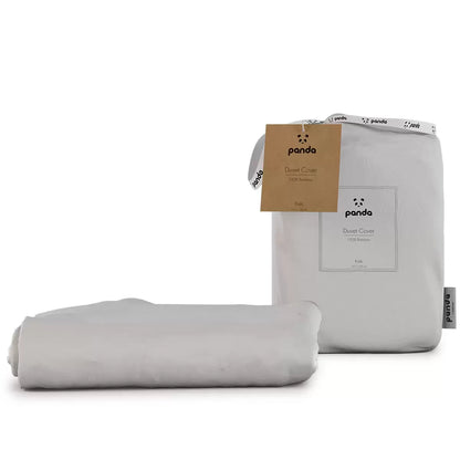 Soft white Panda Children's 100% Bamboo Duvet Cover neatly folded on a cot bed displaying its silky sateen texture.