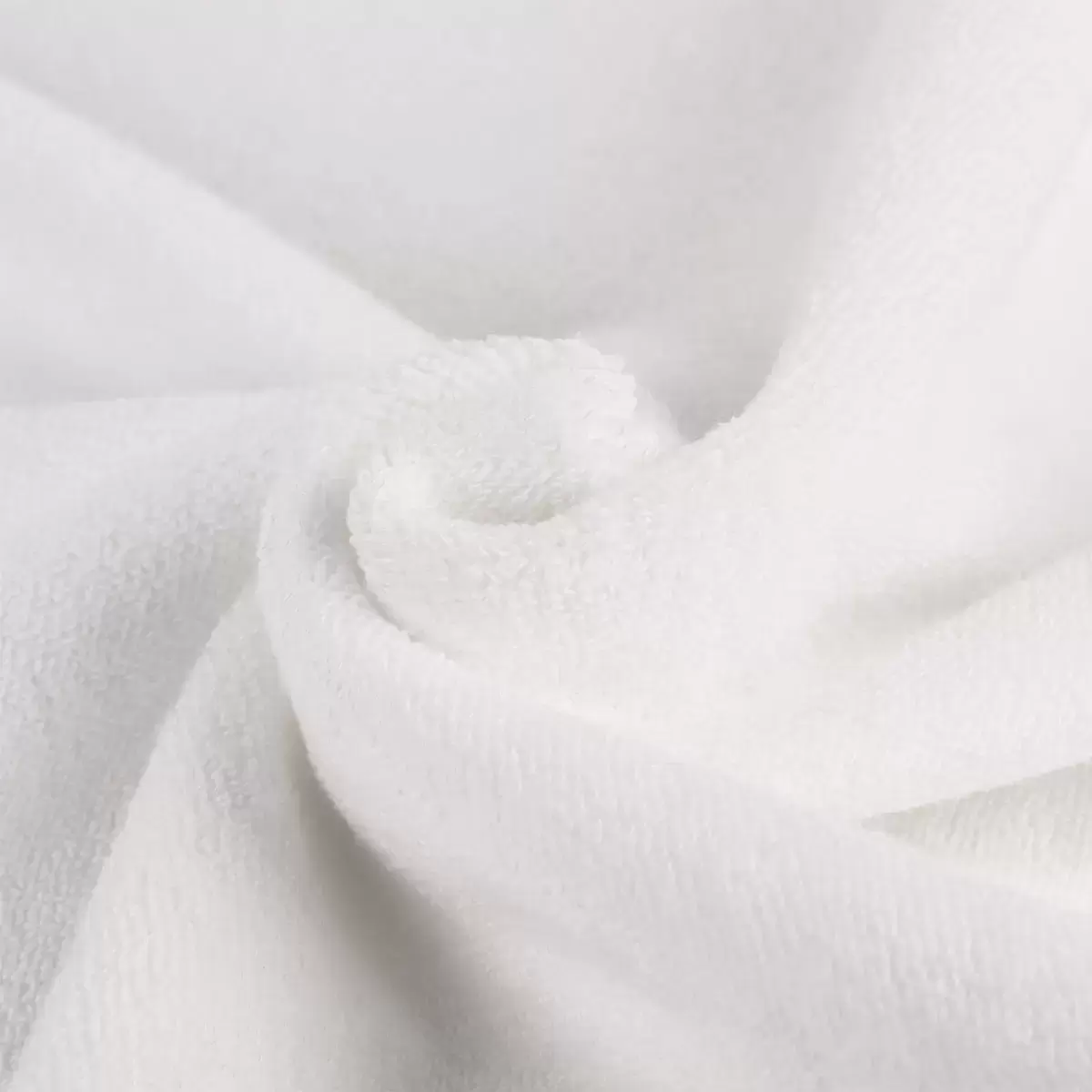 Close-up texture shot of the open-loop, zero-twist fabric on the Panda towel showing its plush thickness and weave quality.