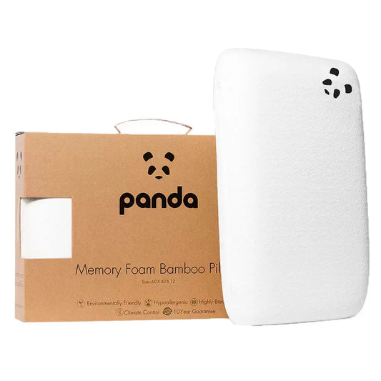 White Panda memory foam pillow featuring a textured silky bamboo cover with subtle brand detailing, shown resting horizontally on a minimalist wooden bed frame.