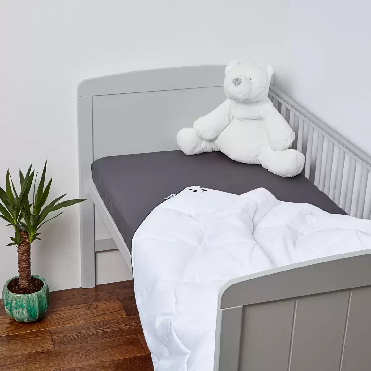Close-up view of the silky 100% bamboo cover fabric and a durable corner loop fastener on the Panda children's duvet.