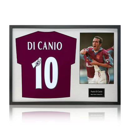 A professionally framed West Ham United jersey autographed by Paolo Di Canio, presented alongside an action photograph in a high-clarity display case.
