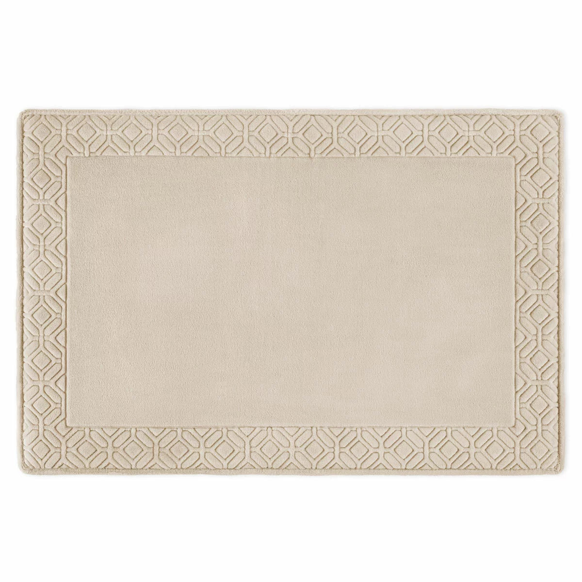Top view of the Paramount taupe memory foam plush bath mat showing leaf-bordered stitched fabric and soft plush texture on a neutral tile floor.