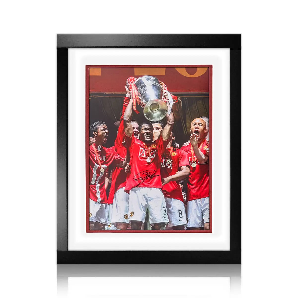 Patrice Evra hand-signed Manchester United action photograph displayed in a premium wooden frame with an etched metal nameplate.