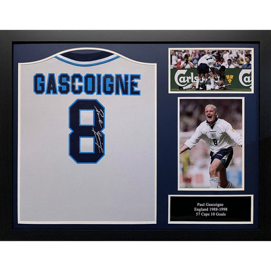 A professionally framed England Euro 96 retro football shirt signed by Paul Gascoigne, captured in a centered studio shot to showcase the signature.