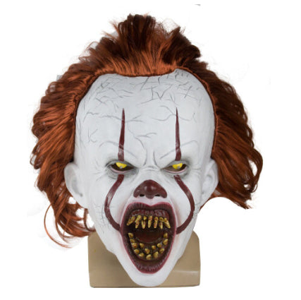 Front view of the adult Pennywise IT clown latex mask featuring realistic white face paint, creepy red smile lines, and bright red synthetic hair.