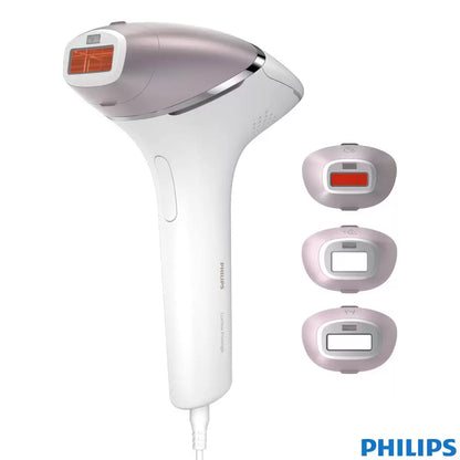 The Philips Lumea Prestige IPL device in a sleek white finish resting next to its four specialized treatment attachments and storage pouch on a clean, modern vanity surface.