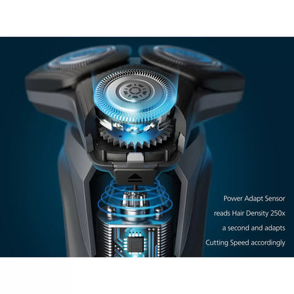 Philips Series 5000 electric shaver in a metallic finish, displayed with its nose trimmer accessory and travel case on a clean bathroom shelf.