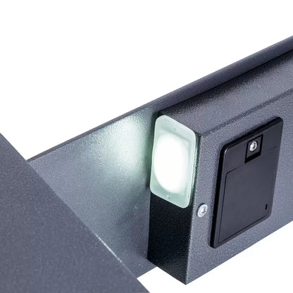 Front perspective view of the dark metallic graphite Phoenix Vela 51-litre security safe, showcasing the digital keypad, key override slot, and sturdy steel door construction against a neutral background.