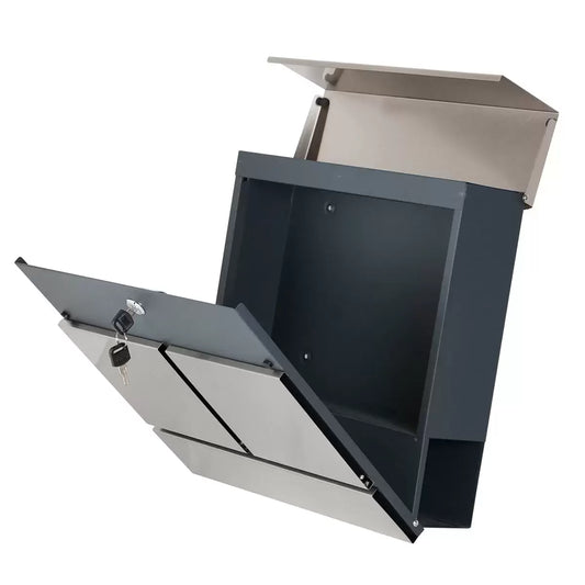 A front-facing product shot of the silver Phoenix Estilo stainless steel letter box mounted on an exterior brick wall, showing its top lid and lower curved newspaper tray.