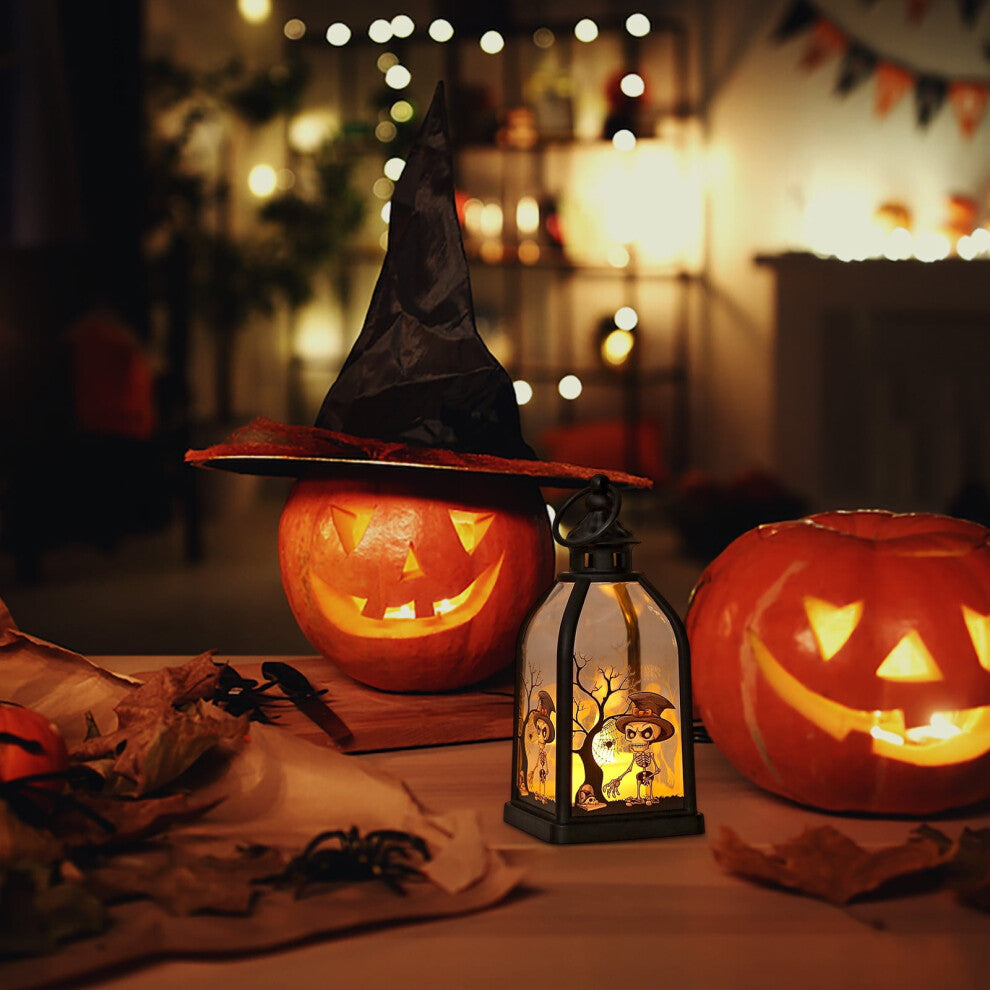 A portable black plastic Halloween handheld lantern glowing warmly with spooky pumpkin and skull pattern designs on a festive party table.