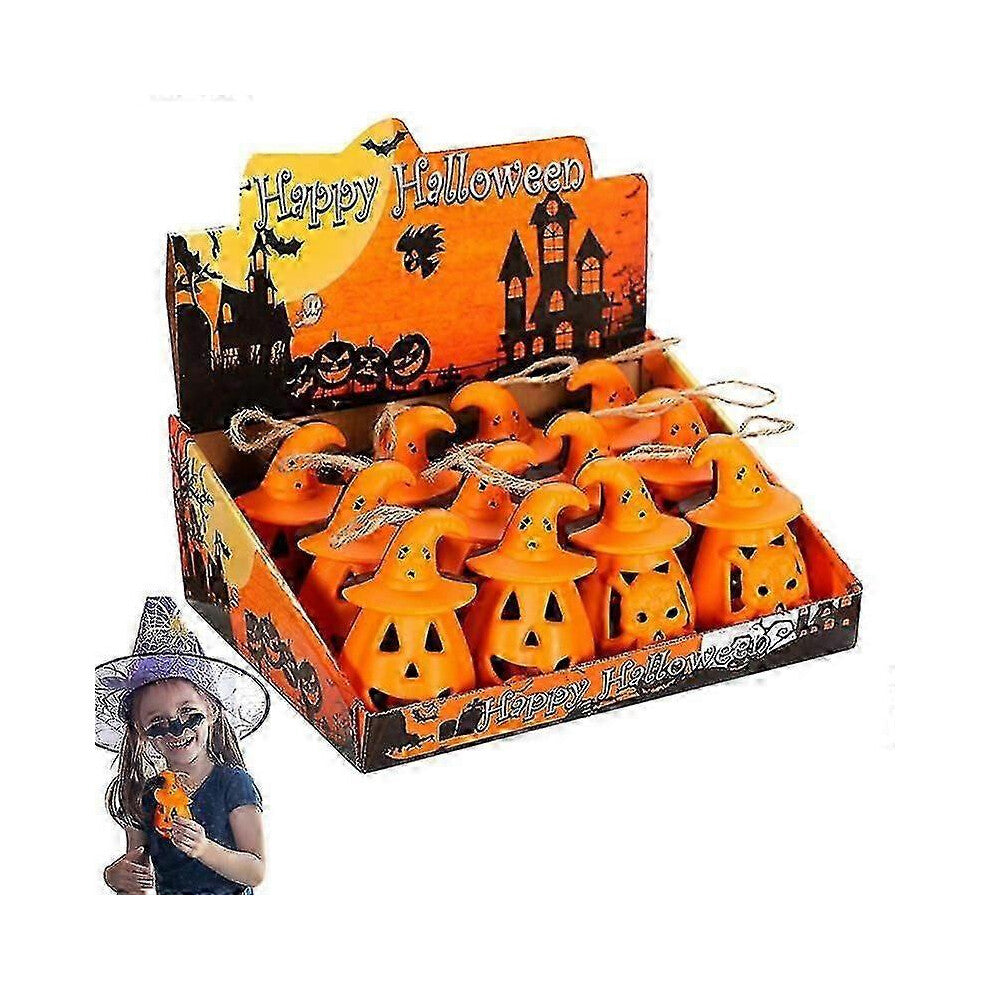 A 12-pack of mini pumpkin and skeleton LED battery-operated tea lights glowing warmly on a festive wooden party table.