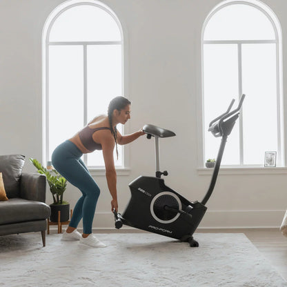 Pro Form 225 CSX Exercise Bike with adjustable resistance, LCD workout monitor, and ergonomic seat for home cardio fitness.