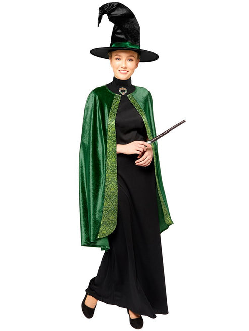 Adult wearing a detailed dark emerald green Professor McGonagall robe set with a matching pointed witch hat in a well-lit studio setting.