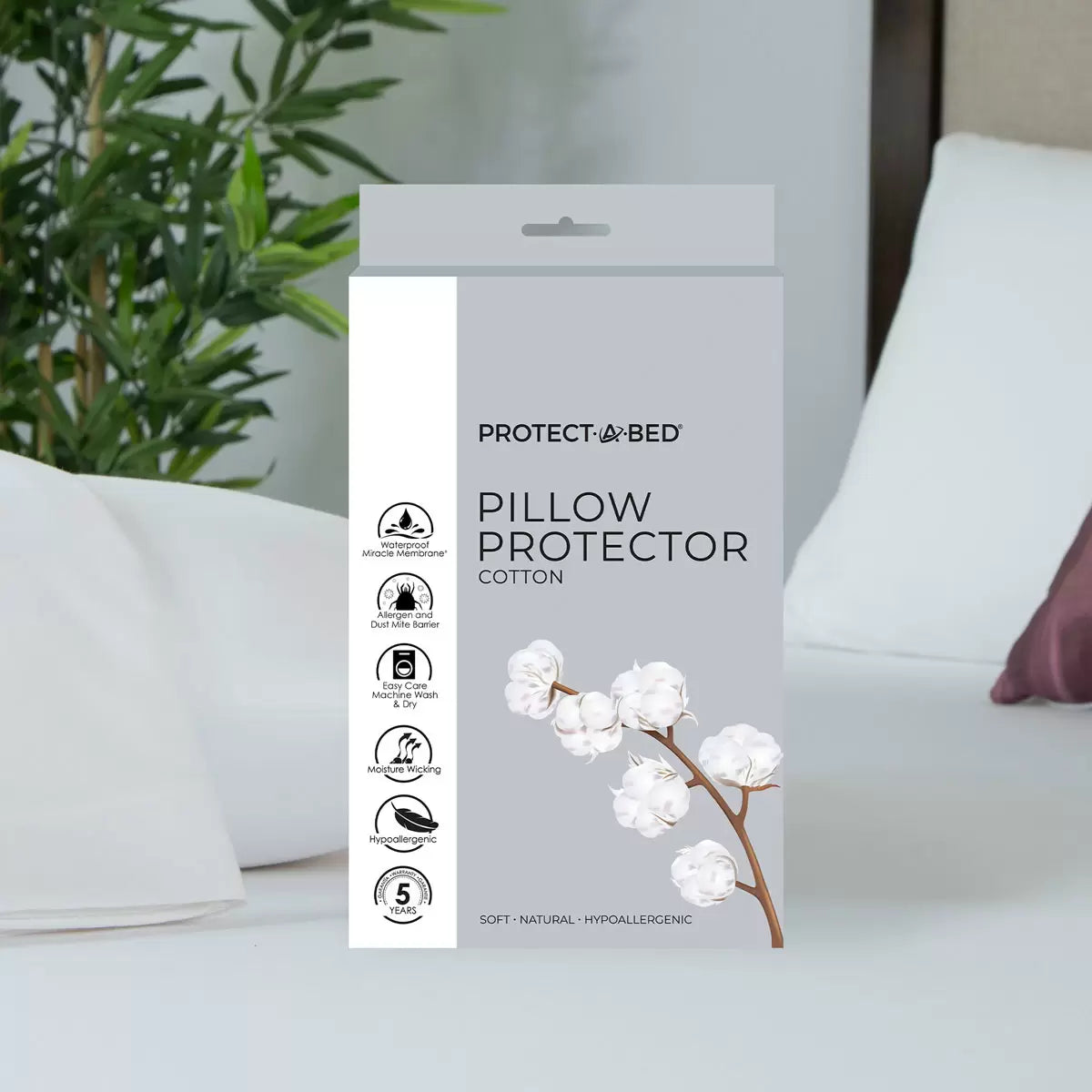 Pair of white protect-a-bed cotton pillow protectors with zippered edge and side mesh ventilation panel displayed flat on light background.