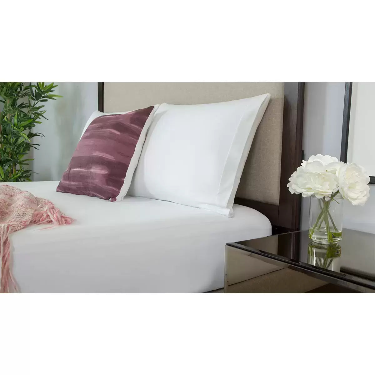 Pair of white protect-a-bed cotton pillow protectors with zippered edge and side mesh ventilation panel displayed flat on light background.