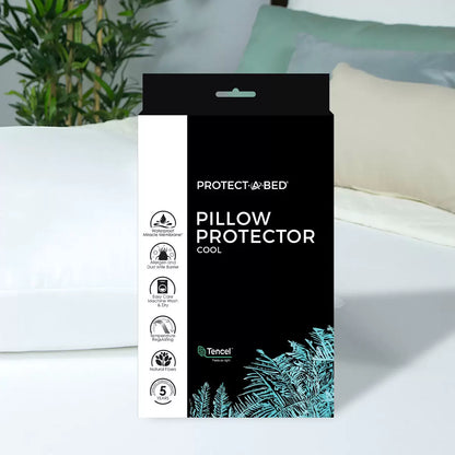 White Protect-A-Bed Tencel Cool Pillow Protector 2 Pack lying on a bed showcasing the smooth fabric texture, mesh side vent, and zipper closure.