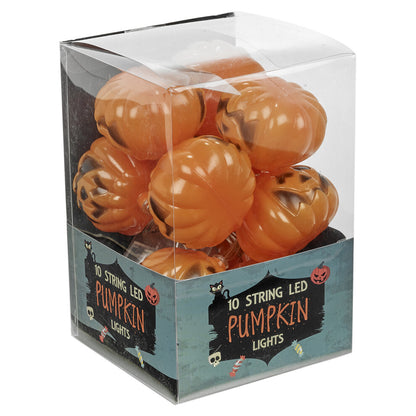 A 1.5-meter string of 10 pumpkin LED lights glowing warmly on a dark indoor party wall.