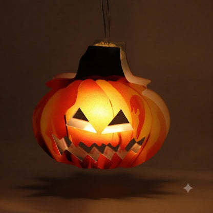 A strand of 10 cute LED pumpkin string lights glowing steadily along an outdoor garden patio fence.