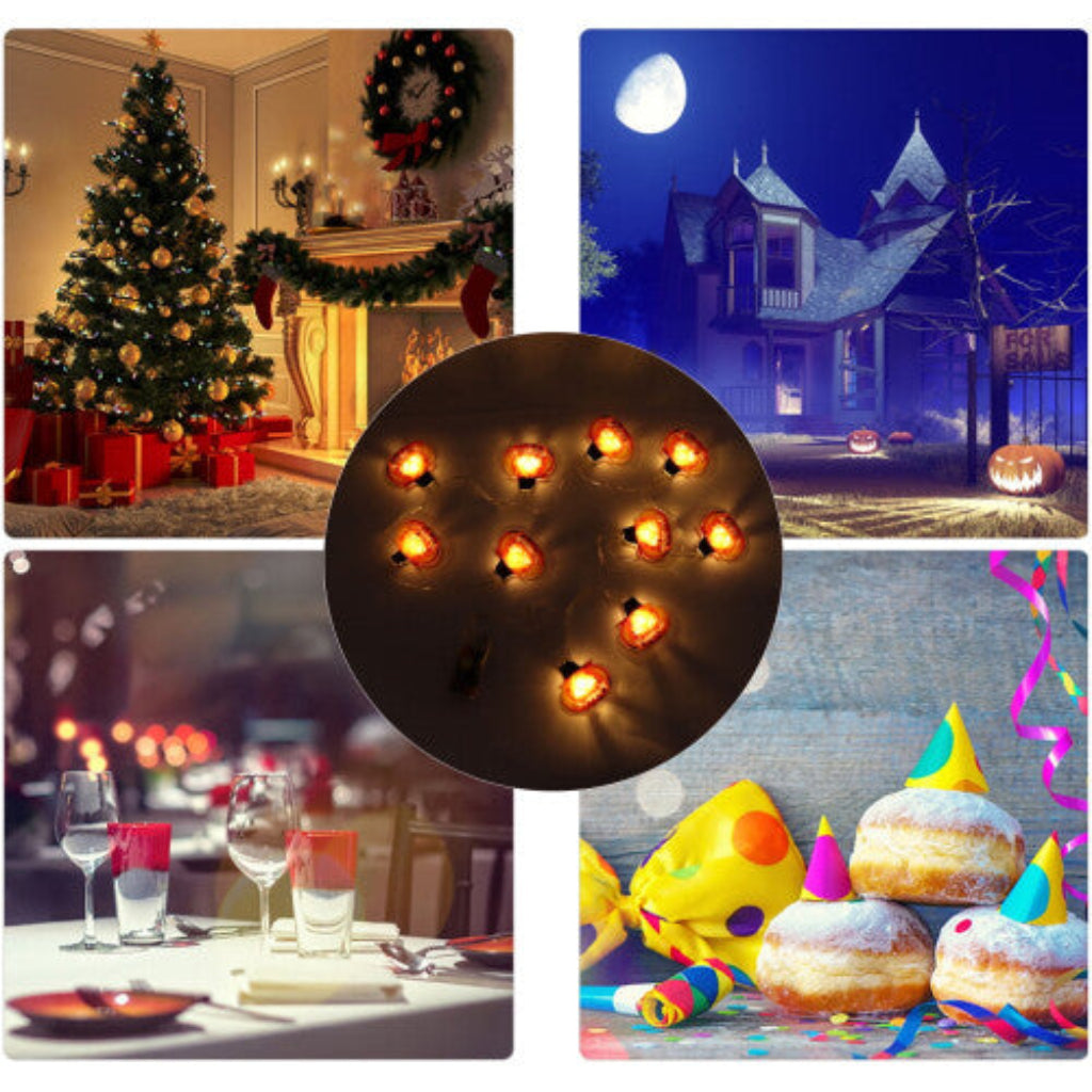 A strand of 10 cute LED pumpkin string lights glowing steadily along an outdoor garden patio fence.