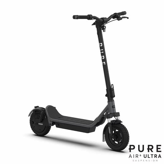Dark grey Pure Air6 Pro+ folding electric scooter showing dual GlideMotion suspension, wide handlebars with integrated turn indicators, and 10-inch tubeless tyres on a neutral background.