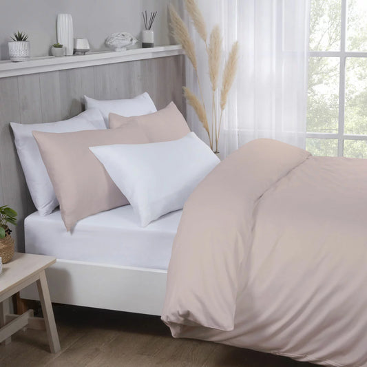 Pink Purity Home 400 thread count cotton sateen king duvet cover set with matching pillowcases neatly arranged on a bed.