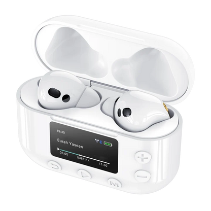 Pair of white Quran Buds Pro wireless earbuds positioned next to their sleek digital display charging case on a dark surface.
