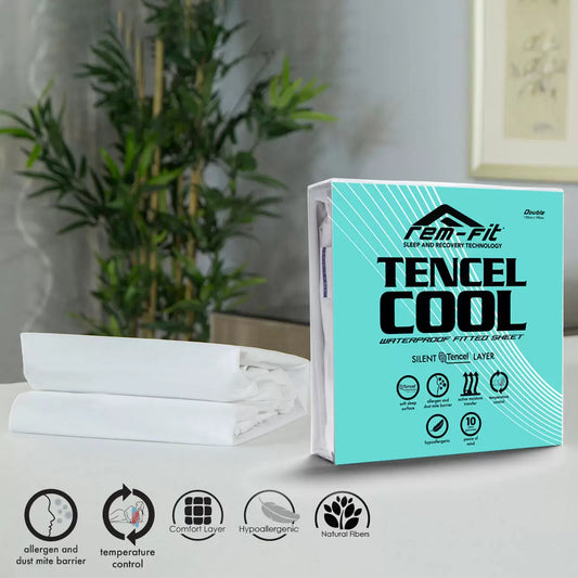 White REM-Fit Tencel Cool Mattress Protector stretched over a plush mattress corner in a minimalist modern bedroom.