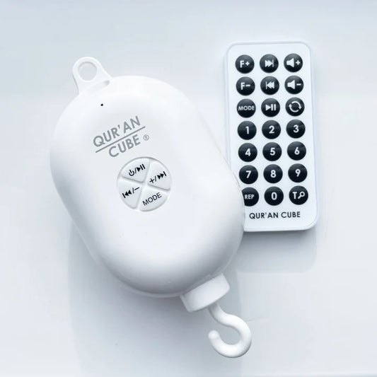 White electronic rechargeable cot mobile motor unit with control buttons resting on a neutral background.