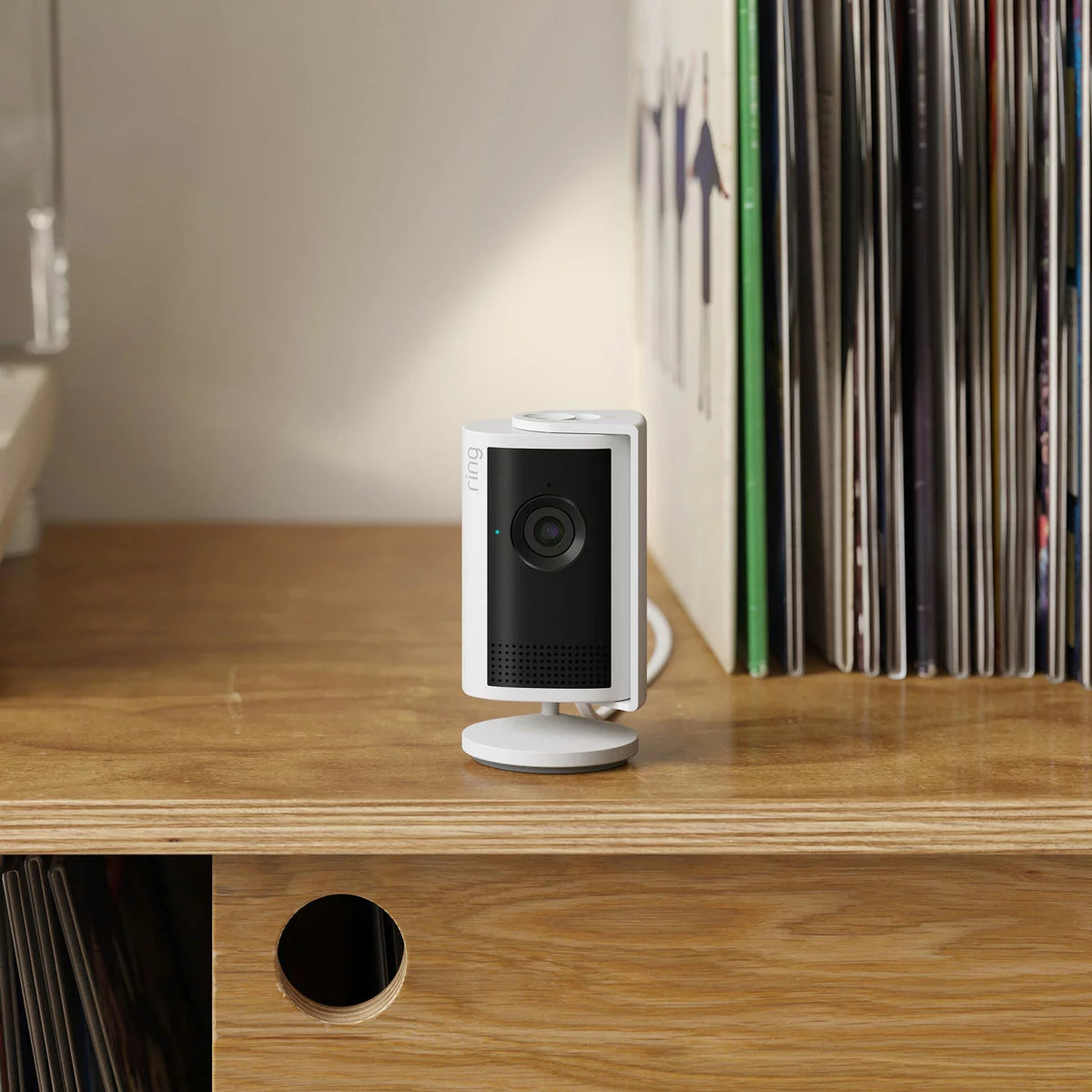 Ring 15 Piece Alarm 2nd Gen Starter Kit in sleek white showing the base station, keypad, outdoor siren, indoor camera, battery video doorbell, sensors, and motion detectors arranged neatly on a modern light backdrop.