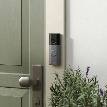 Ring 15 Piece Alarm 2nd Gen Starter Kit in sleek white showing the base station, keypad, outdoor siren, indoor camera, battery video doorbell, sensors, and motion detectors arranged neatly on a modern light backdrop.