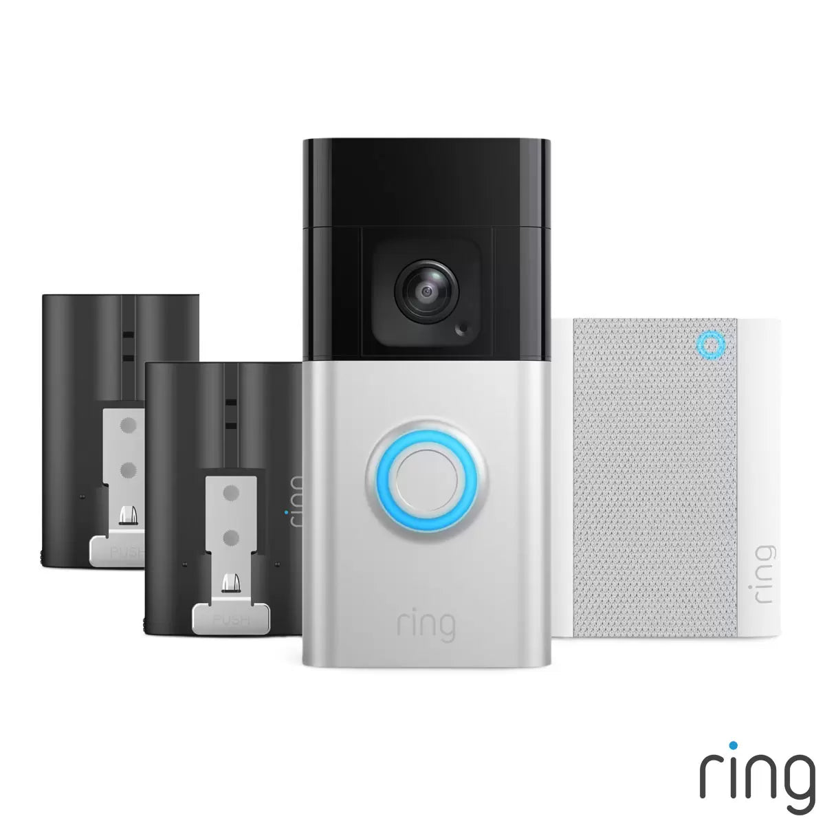 A satin nickel Ring Battery Video Doorbell Pro mounted next to a wooden front door, showing the wide lens perspective, beside a compact white Chime plugged into a hallway socket.