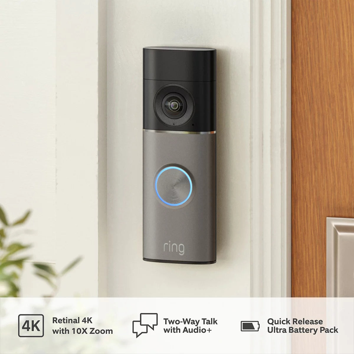 Front angle view of the deep silver Ring Battery Video Doorbell Pro alongside the white plug-in 3rd Gen Chime on a plain neutral surface.