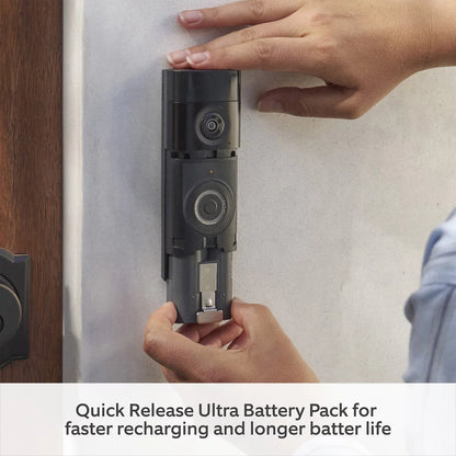 Front angle view of the deep silver Ring Battery Video Doorbell Pro alongside the white plug-in 3rd Gen Chime on a plain neutral surface.