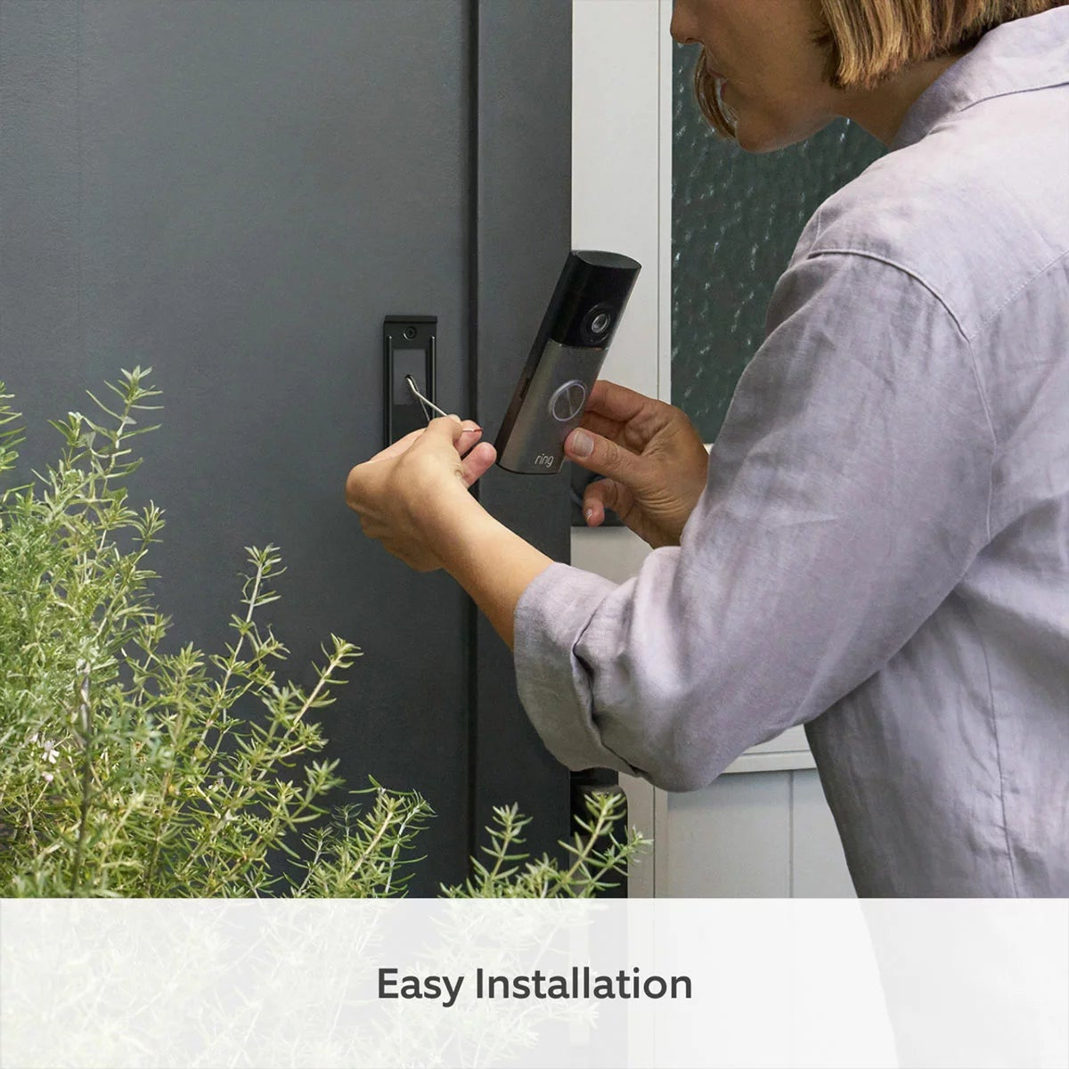 Ring Hardwired Video Doorbell Pro 3rd Gen in satin nickel finish mounted on a modern entryway wall alongside a white Ring Chime.