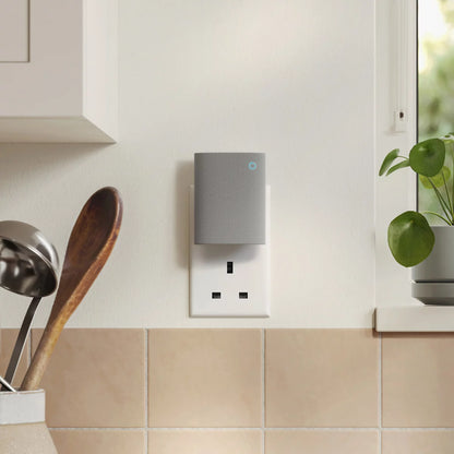 Front view of the satin nickel Ring Plug-In Video Doorbell Pro 3rd Gen mounted next to its white indoor plug-in Chime module on a clean modern backdrop.