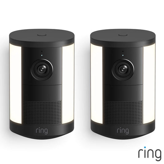 Matte black Ring Spotlight Cam 2nd Gen battery cameras shown as a set of two against a plain backdrop.