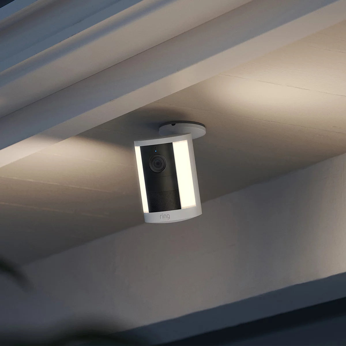 Ring Spotlight Cam 2nd Gen White Battery Security Cameras 2 Pack mounted on exterior wall showing spotlight, lens, and siren speaker.