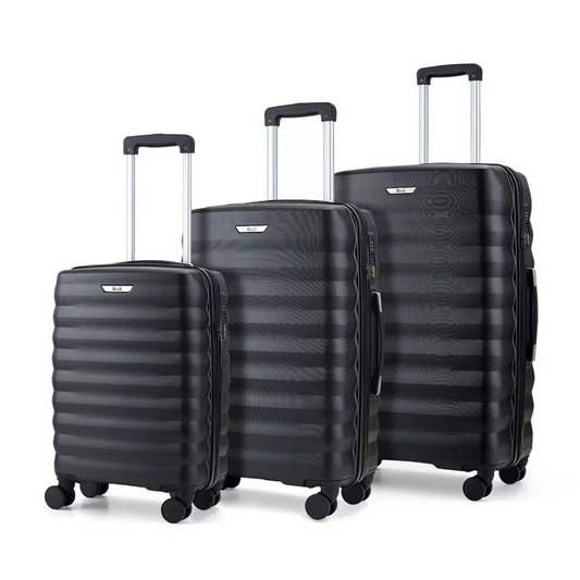 Rock Berlin 3 piece hardside luggage set lined up neatly in graduating sizes on a modern minimalist station platform floor.