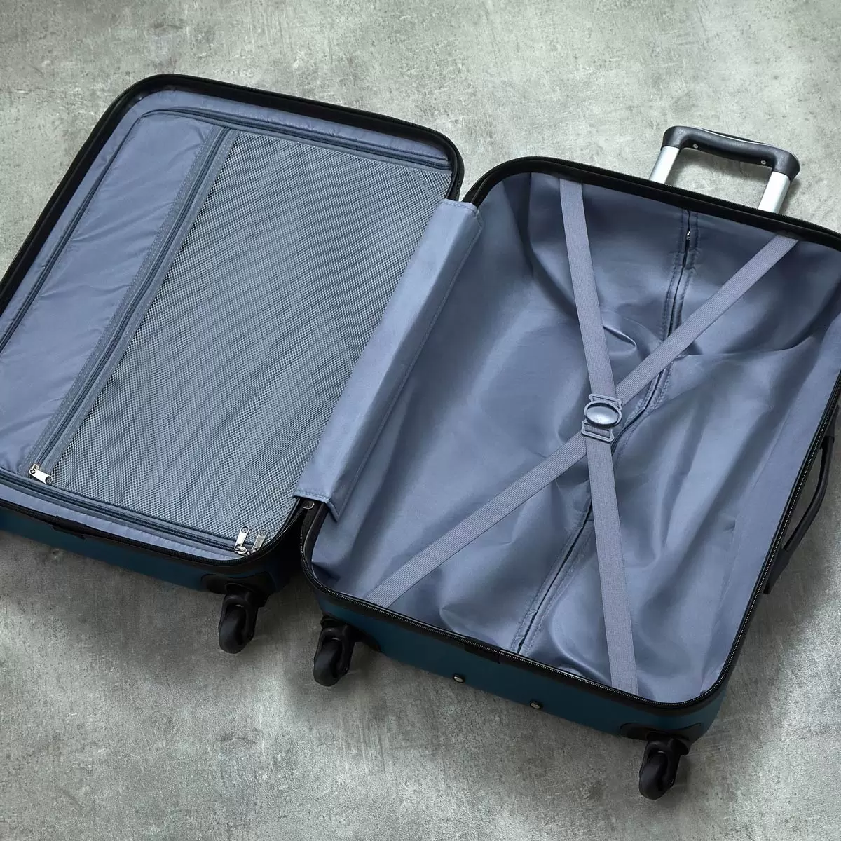 Front view of the vibrant teal Rock Byron 3 piece hardside luggage set lined up on a polished stone terminal floor showing the cabin, medium, and large suitcases.