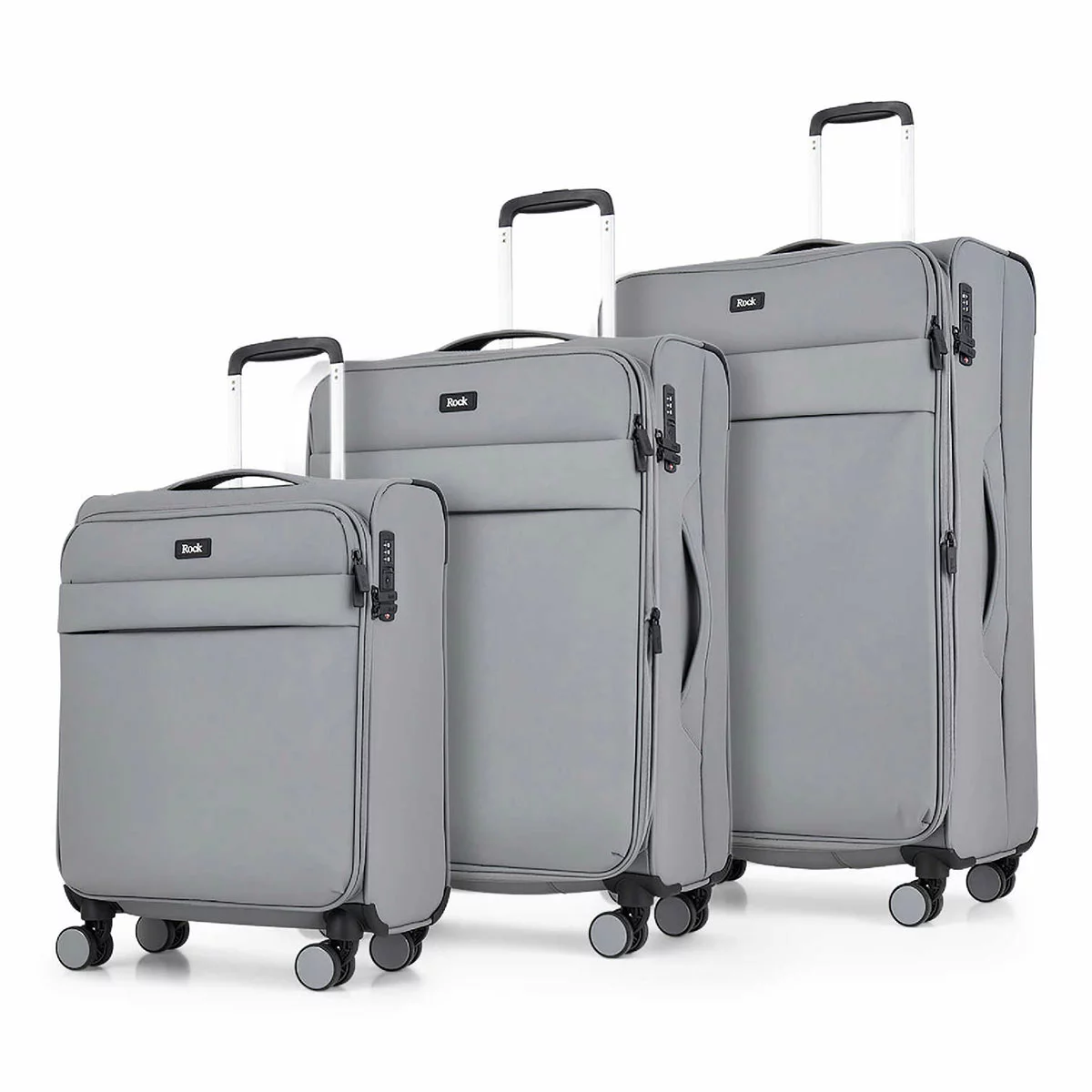 Front angle view of the Rock Harper 3 piece softside luggage set in charcoal grey showing nested cabin, medium, and large expandable suitcases on a modern airport lounge floor.