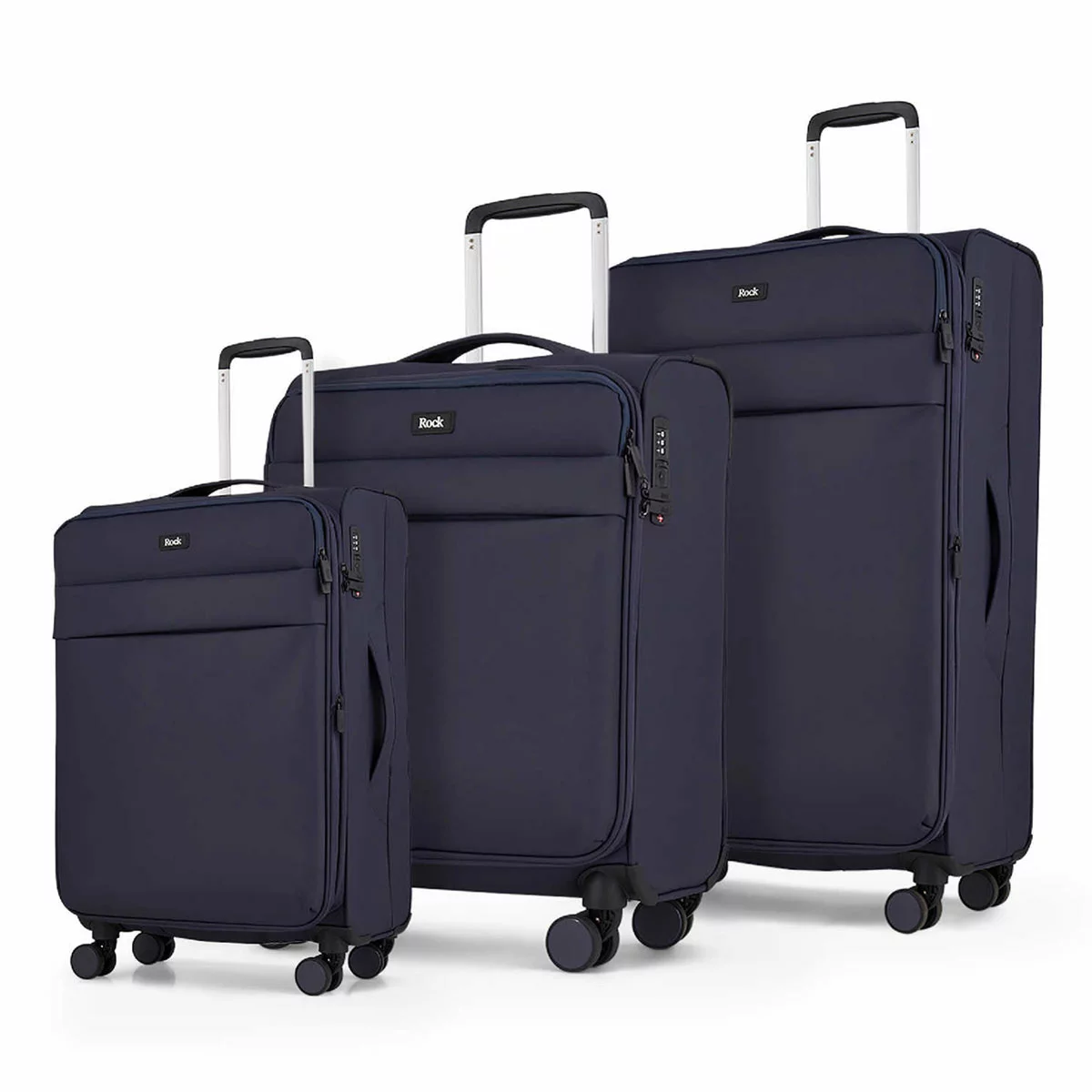 Front angle view of the Rock Harper 3 piece softside luggage set in charcoal grey showing nested cabin, medium, and large expandable suitcases on a modern airport lounge floor.