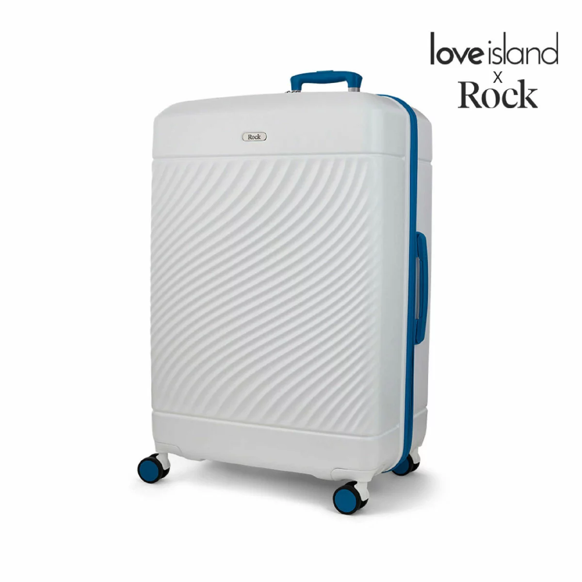 Front angle shot of the vibrant Rock Love Island hardside cabin suitcase standing upright on four double spinner wheels inside a modern airport terminal.