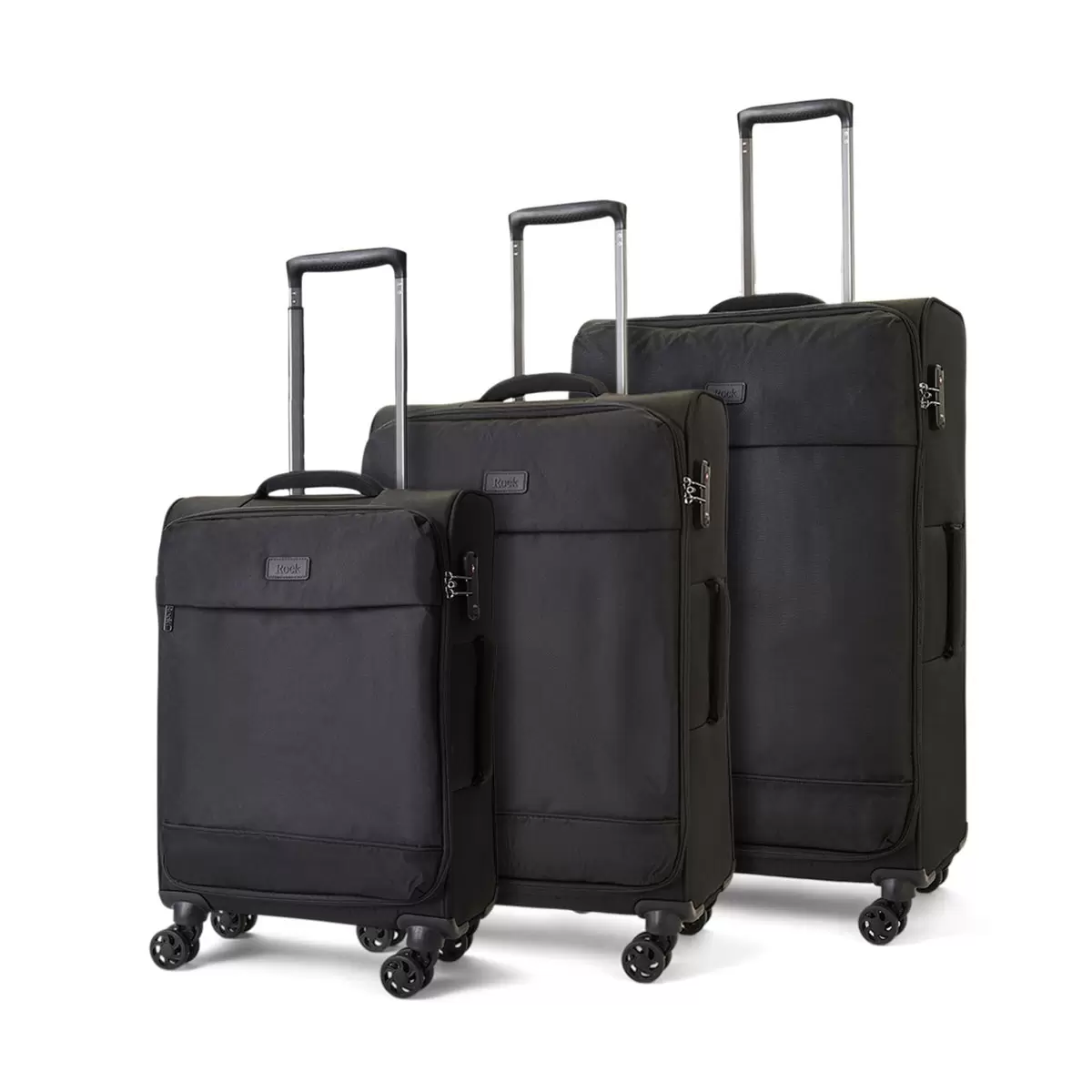Rock Paris 3 piece softside luggage set displayed side by side in four distinct colors on a polished hardwood floor in a sunlit entryway.