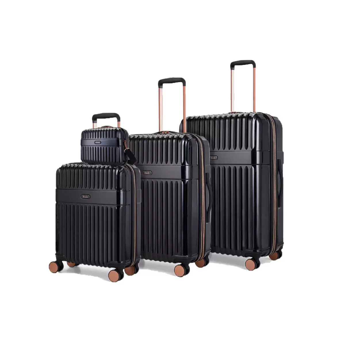 Front angle of four-piece Rock Selene hardside luggage set including vanity case with copper accents standing on a marble floor.