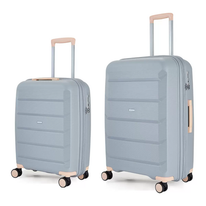 Rock Tulum 2 piece hardside luggage set showing cabin and medium suitcases stacked side by side in a sleek modern terminal.