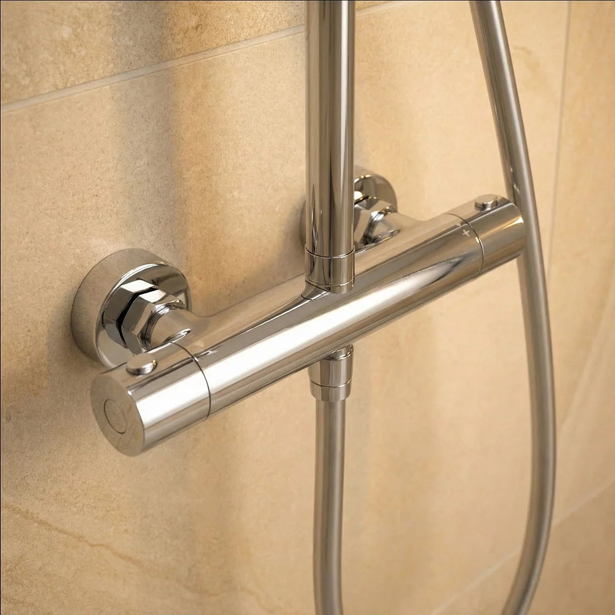 Polished chrome Roper Rhodes Hydroforce exposed bar shower system with 250mm circular overhead head and multi-function handset mounted on a light tile bathroom wall.