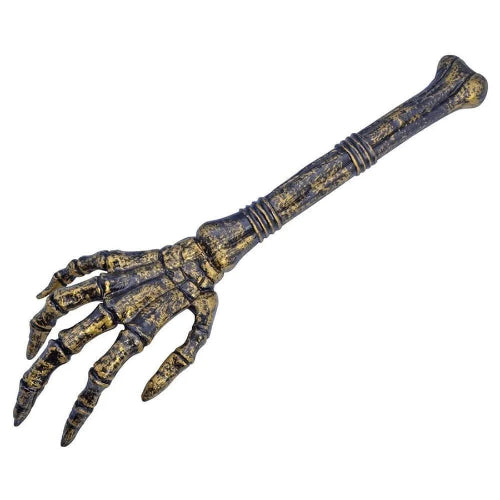 A 66cm Rubies ghost hand Halloween decoration positioned on a dark floor with artificial fog, showcasing its realistic weathered bone structure.