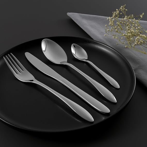 Polished silver 18/10 stainless steel Russell Hobbs Cologne 16 piece cutlery set in retail packaging showing fork, knife, dessert spoon, and teaspoon.